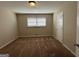 Spacious bedroom with neutral carpeting and ample natural light at 3107 Cherry Blossom Ln, East Point, GA 30344