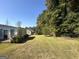 Large backyard perfect for outdoor activities, next to wooded area at 3107 Cherry Blossom Ln, East Point, GA 30344