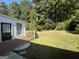 Private backyard with a spacious grassy area and deck at 3107 Cherry Blossom Ln, East Point, GA 30344