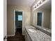 Bathroom with granite countertop vanity and updated fixtures at 3107 Cherry Blossom Ln, East Point, GA 30344