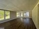 Bright sunroom with wood-look flooring and backyard access at 3107 Cherry Blossom Ln, East Point, GA 30344