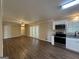 Open living and kitchen area with hardwood floors at 3107 Cherry Blossom Ln, East Point, GA 30344
