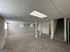 Finished basement with neutral carpeting and built-in shelving at 3107 Cherry Blossom Ln, East Point, GA 30344