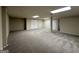 Large finished basement with neutral carpeting and ample storage at 3107 Cherry Blossom Ln, East Point, GA 30344