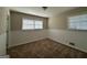 Well-lit bedroom with neutral carpet and wainscoting at 3107 Cherry Blossom Ln, East Point, GA 30344