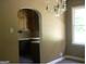 Dining room with an archway opening to the kitchen at 2945 Palm Dr, East Point, GA 30344
