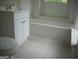 Clean bathroom with a white vanity and tiled floor at 2945 Palm Dr, East Point, GA 30344