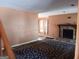 Living room with a stone fireplace and patterned rug at 845 Heritage Oaks Dr, Stone Mountain, GA 30088