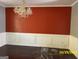 Bright dining room with chandelier and wainscoting at 715 Hennepin Ter, Mcdonough, GA 30253