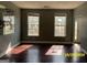 Living room with hardwood floors and large windows at 715 Hennepin Ter, Mcdonough, GA 30253