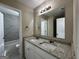 Double vanity bathroom with granite countertop and a view of the shower at 150 Turman Se Ave, Atlanta, GA 30315