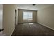 Well-lit bedroom with a large window and neutral carpeting at 150 Turman Se Ave, Atlanta, GA 30315