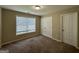 Bright bedroom with double door closet and neutral wall paint at 150 Turman Se Ave, Atlanta, GA 30315