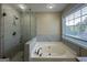 Bathroom features a large walk-in shower and a garden tub with marble tile at 150 Turman Se Ave, Atlanta, GA 30315