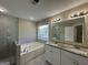 Bathroom boasts a large soaking tub, double vanity, and a walk-in shower at 150 Turman Se Ave, Atlanta, GA 30315
