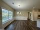 Dining room with hardwood floors, chandelier, and large window at 150 Turman Se Ave, Atlanta, GA 30315