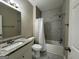 Bathroom with granite countertop vanity, bathtub, and marble tile shower at 150 Turman Se Ave, Atlanta, GA 30315