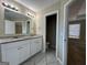Double vanity bathroom with granite countertops and a view of a toilet and shower at 150 Turman Se Ave, Atlanta, GA 30315