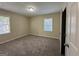 Bright bedroom with neutral carpeting and large window at 2530 Habersham Dr, Decatur, GA 30032