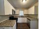 Modern kitchen featuring granite counters and stainless steel appliances at 2530 Habersham Dr, Decatur, GA 30032