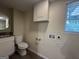 Clean bathroom with granite vanity, toilet, and laundry hookups at 2530 Habersham Dr, Decatur, GA 30032