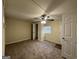 Bright bedroom with carpeted floor, ceiling fan, and ample closet space at 2530 Habersham Dr, Decatur, GA 30032
