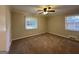 Spacious bedroom featuring carpet, ceiling fan and multiple windows at 739 Yale Sw Pl, Atlanta, GA 30315