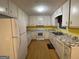 Kitchen with white cabinets and marbled countertops at 115 Lakeview Dr, Stockbridge, GA 30281