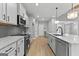 Modern kitchen with white cabinets and stainless steel appliances at 296 Deer Creek Run # 11, Moreland, GA 30259