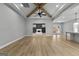 Spacious living room with exposed beams and a fireplace at 296 Deer Creek Run # 11, Moreland, GA 30259