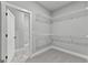 Large walk-in closet with wire shelving and hanging rods at 296 Deer Creek Run # 11, Moreland, GA 30259