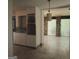 Kitchen with white cabinets and view into sunroom at 10219 N Dinah Cir, Covington, GA 30014