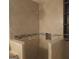 Walk-in shower with mosaic tile accent and beige tile at 10219 N Dinah Cir, Covington, GA 30014