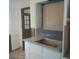 Kitchen features new granite countertops and updated backsplash at 10219 N Dinah Cir, Covington, GA 30014