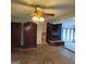 Living room features a fireplace, ceiling fan, and built-in shelving at 10219 N Dinah Cir, Covington, GA 30014