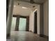Sunroom with skylights, glass block windows, and stone pillars at 10219 N Dinah Cir, Covington, GA 30014