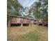 Ranch home with wooden deck and backyard at 10219 N Dinah Cir, Covington, GA 30014