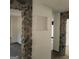 Unique hallway with stone pillars and built-in niche at 10219 N Dinah Cir, Covington, GA 30014
