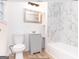 Updated bathroom with gray vanity and marble-look tile at 3363 Delmar Nw Ln, Atlanta, GA 30331
