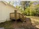 Wooden deck and steps leading to a private backyard at 3363 Delmar Nw Ln, Atlanta, GA 30331