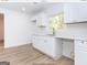 Modern white kitchen with new appliances and countertops at 3363 Delmar Nw Ln, Atlanta, GA 30331