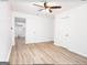 Bedroom with ceiling fan, light flooring, and access to laundry at 3363 Delmar Nw Ln, Atlanta, GA 30331