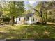Charming white house with green door and landscaped yard at 3363 Delmar Nw Ln, Atlanta, GA 30331