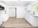 Modern white kitchen with new appliances and countertops at 3363 Delmar Nw Ln, Atlanta, GA 30331