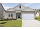 Modern farmhouse exterior with gray siding and white trim at 149 Avondale Blvd, Conyers, GA 30013