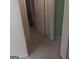 Carpeted hallway with doors to other rooms at 1056 Shadow Lake Dr, Lithonia, GA 30058