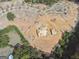 New home construction in progress with surrounding woods at 4333 Shiloh Rd, Cumming, GA 30040