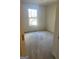 Well-lit bedroom with carpeted floor and window at 6995 Pine Shadow Way, Winston, GA 30187