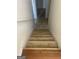 Beige carpeted stairs leading down to the first floor at 6995 Pine Shadow Way, Winston, GA 30187
