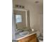 Bathroom with vanity, sink, toilet and mirror at 6995 Pine Shadow Way, Winston, GA 30187